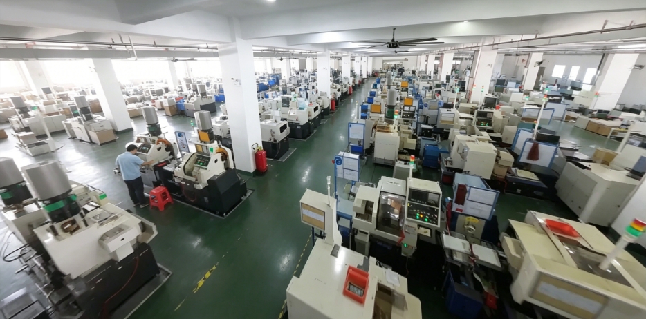 Large manufacturing floor filled with automated industrial machinery.