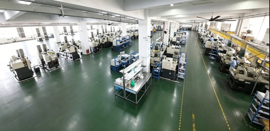 Large manufacturing workshop floor with rows of machinery.